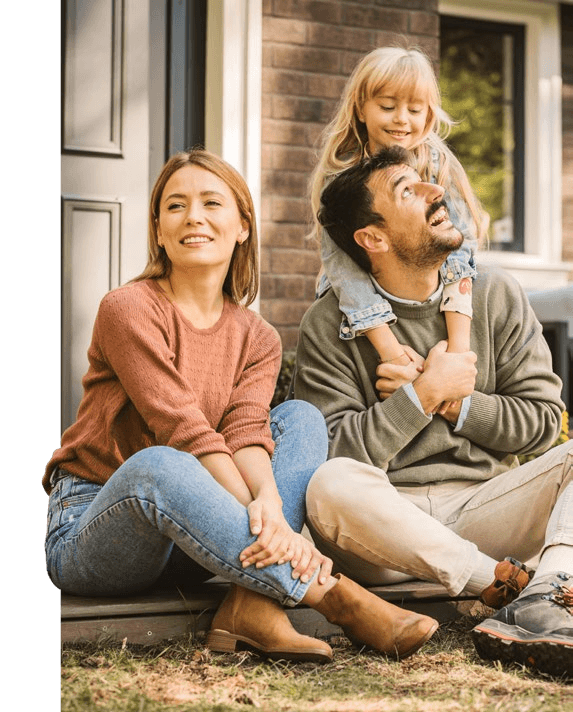 Family in front of their Belleau home